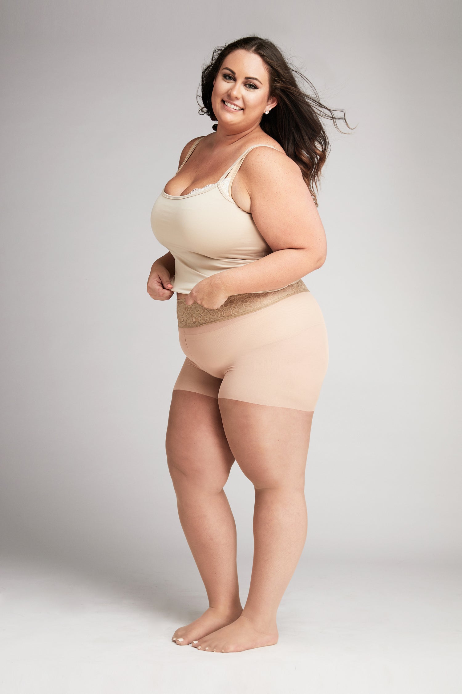 Part of woman body perfect shape hips legs skin tan wear stockings